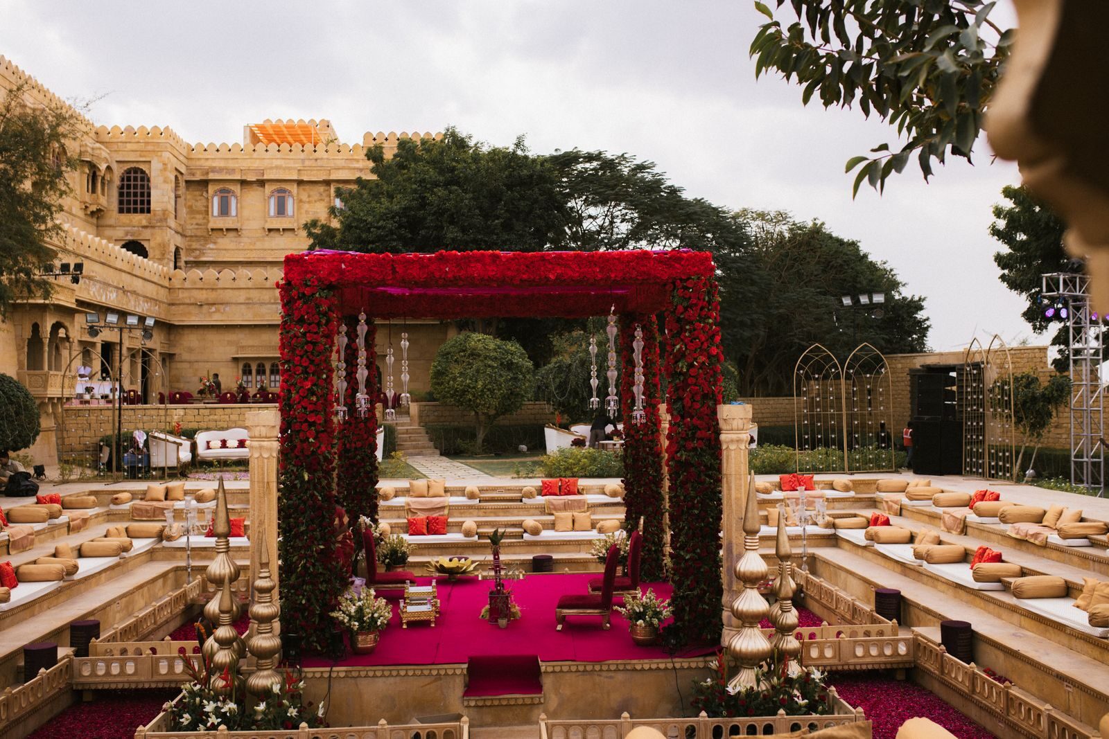 Stock photo: festive event decor with red and gold drapery and marigold flowers